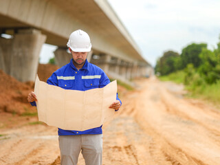 Back one architect standing outdoor at home building construction site
