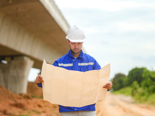 Back one architect standing outdoor at home building construction site