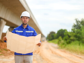 Back one architect standing outdoor at home building construction site