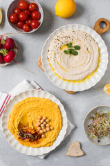 Healthy white bean and pumpkin hummus for snacking. Different types of hummus. Vegetarian snack