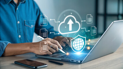 A man uses a stylus on a laptop, with a digital cloud and global security shield appearing above the keyboard, symbolizing secure data upload and cloud computing