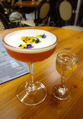 Elegant Pornstar Martini cocktail with passion fruit garnish and sparkling prosecco shot, served on...
