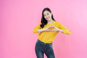 A stylish long hair female model is wearing casual wear, posing and taking pictures in a studio...