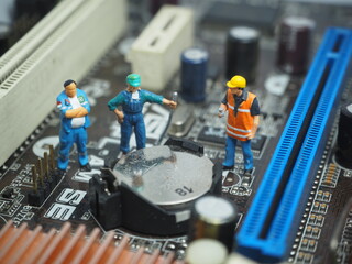 Mini toy of action figure at table with blurred background. Toy photography concept design. Electronic device sevice conceptual design.