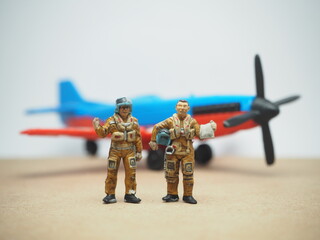 Mini toy of action figure at table with blurred background. Miniature photography concept design.