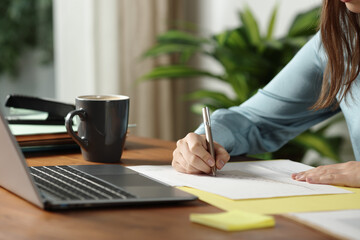 Office worker hands writing on document