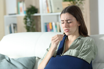 Convalescent woman suffering ready to take painkiller pill