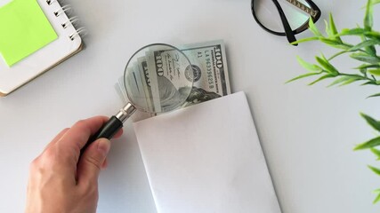 magnifying glass on corners of 100 dollars bill new - Powered by Adobe