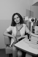 Woman undergoing professional eye exam with advanced ophthalmology diagnostic equipment