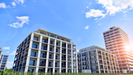 Modern apartment buildings on a sunny day with a blue sky. Facade of a modern apartment building....