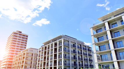 Modern apartment buildings on a sunny day with a blue sky. Facade of a modern apartment building....