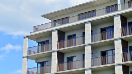 Modern apartment buildings on a sunny day with a blue sky. Facade of a modern apartment building....