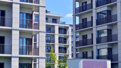 Modern apartment buildings on a sunny day with a blue sky. Facade of a modern apartment building....