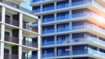 Modern apartment buildings on a sunny day with a blue sky. Facade of a modern apartment building. Modern residential apartment building complex condo.