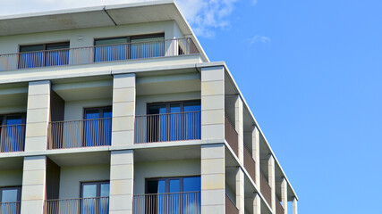 Modern apartment buildings on a sunny day with a blue sky. Facade of a modern apartment building. Modern residential apartment building complex condo.