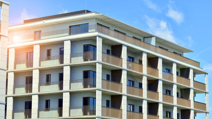 Modern apartment buildings on a sunny day with a blue sky. Facade of a modern apartment building. Modern residential apartment building complex condo.