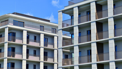 Modern apartment buildings on a sunny day with a blue sky. Facade of a modern apartment building. Modern residential apartment building complex condo.