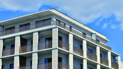 Modern apartment buildings on a sunny day with a blue sky. Facade of a modern apartment building. Modern residential apartment building complex condo.