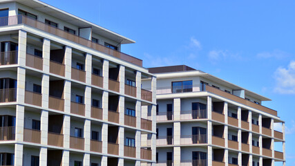 Modern apartment buildings on a sunny day with a blue sky. Facade of a modern apartment building. Modern residential apartment building complex condo.