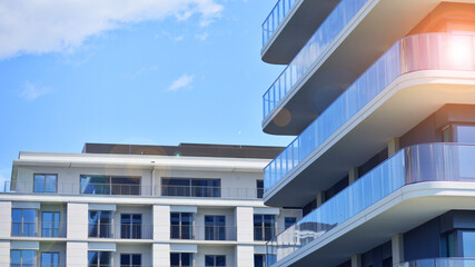 Modern apartment buildings on a sunny day with a blue sky. Facade of a modern apartment building. Modern residential apartment building complex condo.