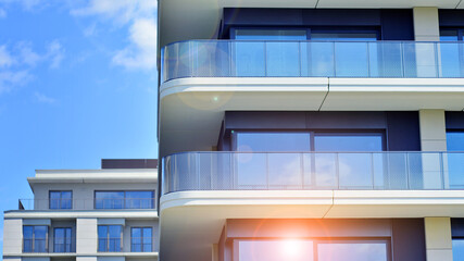 Modern apartment buildings on a sunny day with a blue sky. Facade of a modern apartment building. Modern residential apartment building complex condo.