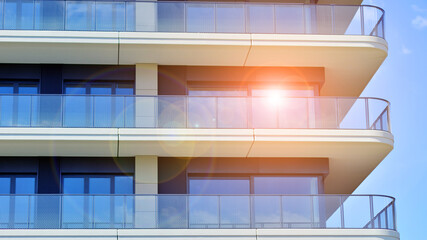 Modern apartment buildings on a sunny day with a blue sky. Facade of a modern apartment building. Modern residential apartment building complex condo.