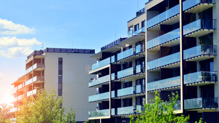 Modern apartment buildings on a sunny day with a blue sky. Facade of a modern apartment building. Modern residential apartment building complex condo.