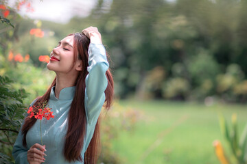 Serene Vietnamese Girl in Traditional Dress Enjoying Nature's Beauty