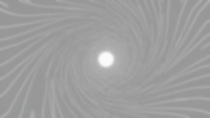 Abstract swirl pattern with a glowing white center point in monochrome gray tones creating a sense of depth and movement