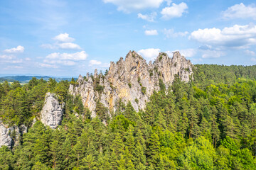 Suche skaly features stunning sandstone rock formations rising above lush green forests in the...