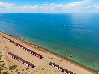 Beach houses on the shore of Lake Balkhash. Summer vacation. The view from the drone.