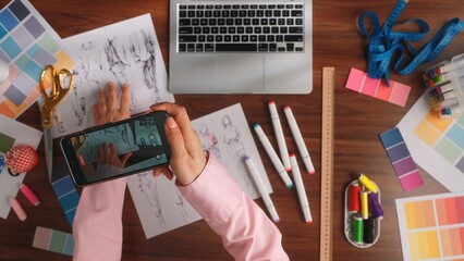 Creative Fashion Designers Workspace with Tools and Sketches