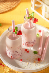 Delicious and homemade red currant bubble tea made of forest.