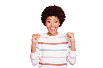 Photo of excited dark skin wavy lady celebrating excellent exam result raising fists wear white striped pullover isolated pastel pink color background