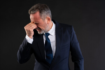 Businessman feeling stressed and exhausted
