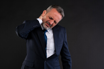Businessman suffering from neck pain