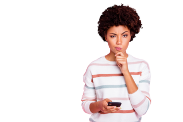Photo of pretty dark skin lady holding telephone deciding what comment to write hand touch chin wear white striped pullover isolated pastel pink color background