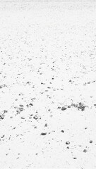 Pebbles on white sand