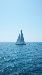 Solitary sailboat silhouette at sea