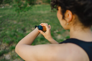 Woman checking smartwatch in outdoor setting