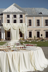 Outdoor Banquet with Fresh Fruits and Castle View