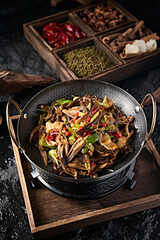 Chinese food: pork belly with pepper and garlic sprouts, tea tree mushroom