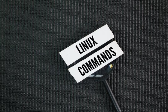 A magnifying glass with the words Linux commands. instructions that users input into a terminal to interact with the operating system.