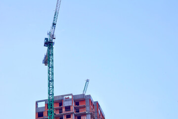 Construction industry.New building.Large high rise crane