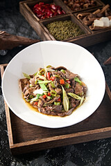 Sichuan style stir-fried pork liver with rice pepper and garlic sprouts