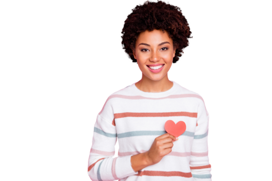 Photo of toothy fascinating cute charming nice black youngster showing her love heart red shape smiling beaming wearing white striped sweater isolated over pink pastel color background