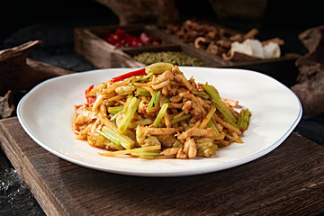 Chinese food Hunan style stir-fried pork tenderloin with pickled pepper and celery