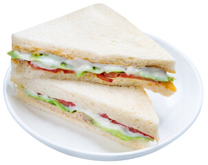 Sandwich with fresh vegetables and creamy salad dressing on white plate isolete on white background with clipping path PNG File.