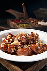 Chinese braised pork trotters with onion