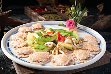 Chinese Cantonese cuisine Zucchini, white mushroom, lotus root slices, fried water chestnut and shrimp cakes